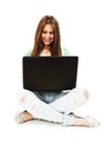 Attractive teenage girl using notebook computer Royalty Free Stock Photo