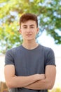 Attractive teenager guy in a park