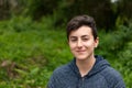 Attractive teenager guy in a park