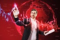 Attractive thoughtful young european businessman with tablet using glowing falling red forex chart and globe on blurry background Royalty Free Stock Photo
