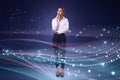 Attractive thoughtful young european businesswoman standing on abstract glowing blue metaverse background. Digital world and