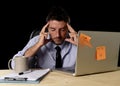 Attractive tired businessman in shirt and tie tired overwhelmed heavy work load exhausted at office