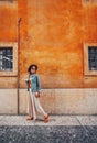 Attractive tourist with a retro camera in summer