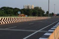 An attractive view of the public modern road and the check posts and traffic lights and buildings on it