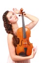 Attractive violinist posing with violin