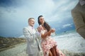 Attractive wedding couple letting go white doves at beautiful ce Royalty Free Stock Photo