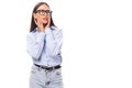 attractive well-groomed young brunette caucasian woman in glasses is dressed in a sky blue shirt on a white background Royalty Free Stock Photo