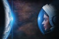 Attractive woman astronaut against Earth planet in outer space. Elements of this image furnished by NASA Royalty Free Stock Photo