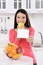 Attractive woman with basket of fruits