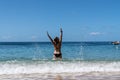 Attractive woman in bikini playing in water, Woman sending water over her head