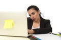 Attractive woman in business suit working tired and bored in office computer desk looking sad Royalty Free Stock Photo