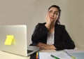 Attractive woman in business suit working tired and bored in office computer desk looking sad Royalty Free Stock Photo