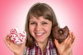 Attractive woman is choosing between two donuts Royalty Free Stock Photo