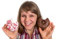 Attractive woman is choosing between two donuts Royalty Free Stock Photo