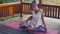 Attractive woman doing yoga exercises. Kapotasana