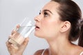 Attractive woman drinking a glass of mineral water Royalty Free Stock Photo