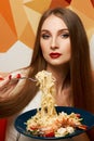 Attractive woman eating seafood pasta Royalty Free Stock Photo