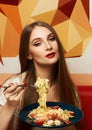 Attractive woman eating seafood pasta Royalty Free Stock Photo
