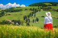 Attractive woman enjoying the view from the hill, Tuscany, Italy Royalty Free Stock Photo