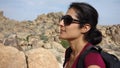 An attractive woman enjoys hiking Joshua Tree National Park