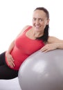 Attractive woman on excersise ball Royalty Free Stock Photo