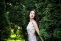 Attractive woman, fashion model in green garden. Outdoor Royalty Free Stock Photo