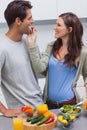 Attractive woman feeding her husband cherry tomato Royalty Free Stock Photo