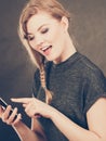 Attractive woman flirting texting on mobile phone Royalty Free Stock Photo