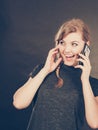 Attractive woman flirting texting on mobile phone. Royalty Free Stock Photo