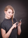 Attractive woman flirting texting on mobile phone. Royalty Free Stock Photo