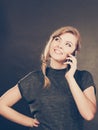 Attractive woman flirting texting on mobile phone. Royalty Free Stock Photo