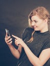 Attractive woman flirting texting on mobile phone. Royalty Free Stock Photo