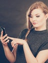 Attractive woman flirting texting on mobile phone. Royalty Free Stock Photo