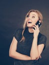 Attractive woman flirting texting on mobile phone. Royalty Free Stock Photo