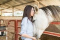 Attractive Woman Giving Her Horse A Kiss