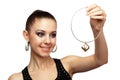 Attractive woman with golden necklace in her hand Royalty Free Stock Photo