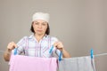 Attractive Woman Hanging Wet Clean Cloth To Dry On Clothes Line Royalty Free Stock Photo
