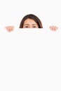 Attractive woman hidding behind a board Royalty Free Stock Photo