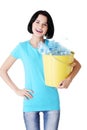 Attractive woman holding bin with plastic bottles. recycling. Royalty Free Stock Photo