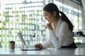 Young woman holding credit card and using computer tablet for online shopping or online payment transaction. Royalty Free Stock Photo