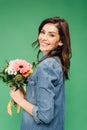 Attractive woman holding flower bouquet and looking at camera isolated Royalty Free Stock Photo