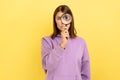 Attractive woman holding magnifying glass and looking at camera with big zoom eye. Royalty Free Stock Photo