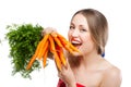 Attractive woman holds bunch of carrots Royalty Free Stock Photo