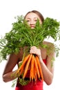 Attractive woman holds bunch of carrots Royalty Free Stock Photo