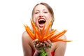 Attractive woman holds bunch of carrots Royalty Free Stock Photo