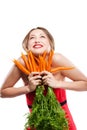Attractive woman holds bunch of carrots Royalty Free Stock Photo