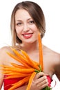 Attractive woman holds bunch of carrots Royalty Free Stock Photo