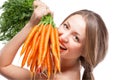 Attractive woman holds bunch of carrots Royalty Free Stock Photo