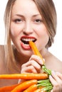 Attractive woman holds bunch of carrots Royalty Free Stock Photo