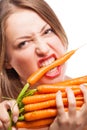 Attractive woman holds bunch of carrots Royalty Free Stock Photo